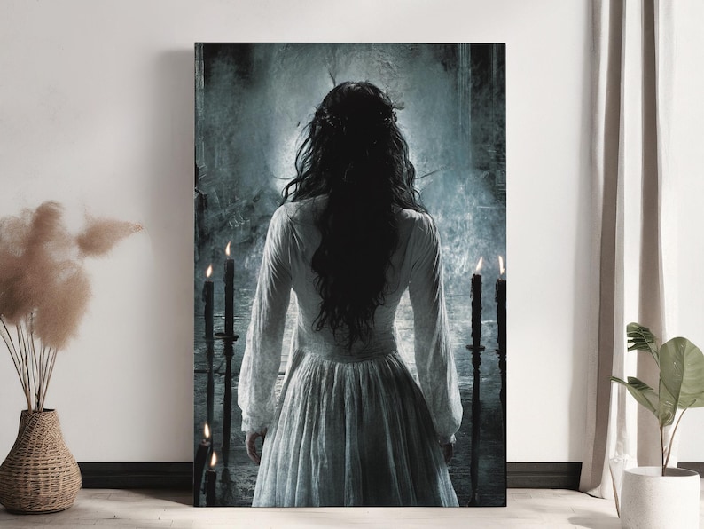May include: A woman in a white dress with long black hair stands in front of a dark, misty background. She is surrounded by four lit candles.