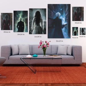 May include: A set of nine framed prints featuring various fantasy and magical scenes. The prints are arranged on a wall above a gray sofa with a glass coffee table. The prints are in different sizes, ranging from 5x7 inches to 32x48 inches.