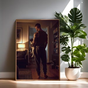 May include: A framed mirror reflects a person holding a small dog in a well-lit room. A large potted plant with green leaves stands beside the mirror. The room has a warm, inviting atmosphere with a wooden floor.