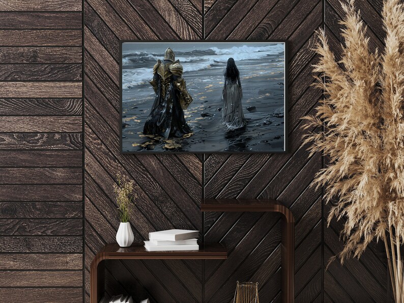 May include: A framed print of a painting depicting a knight in armour walking away from a woman in a white dress on a beach. The knight is wearing gold armour and a black cloak. The woman is walking towards the ocean. The background is a stormy sea.