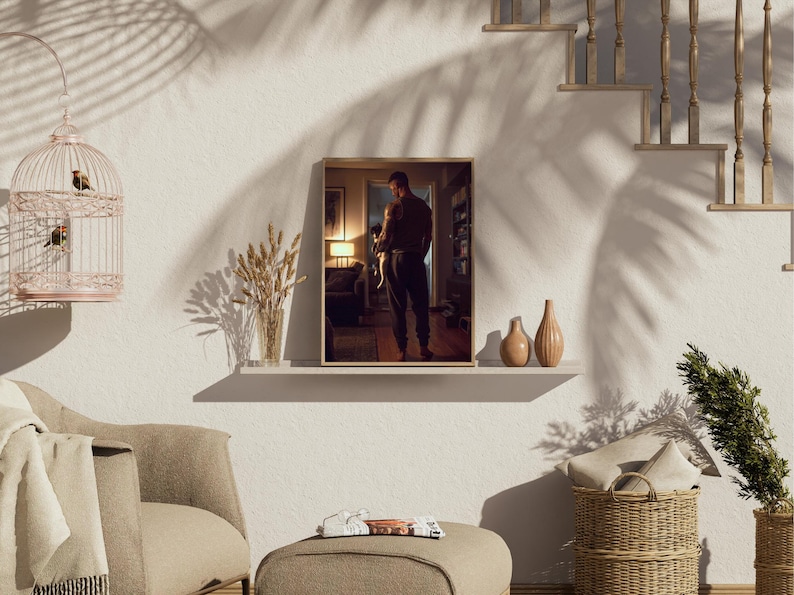 May include: A framed print of a person holding a small dog, displayed on a white shelf with two decorative vases. The room is decorated with a birdcage, a chair, and a footstool. The image is lit by natural light, with shadows from a nearby plant.