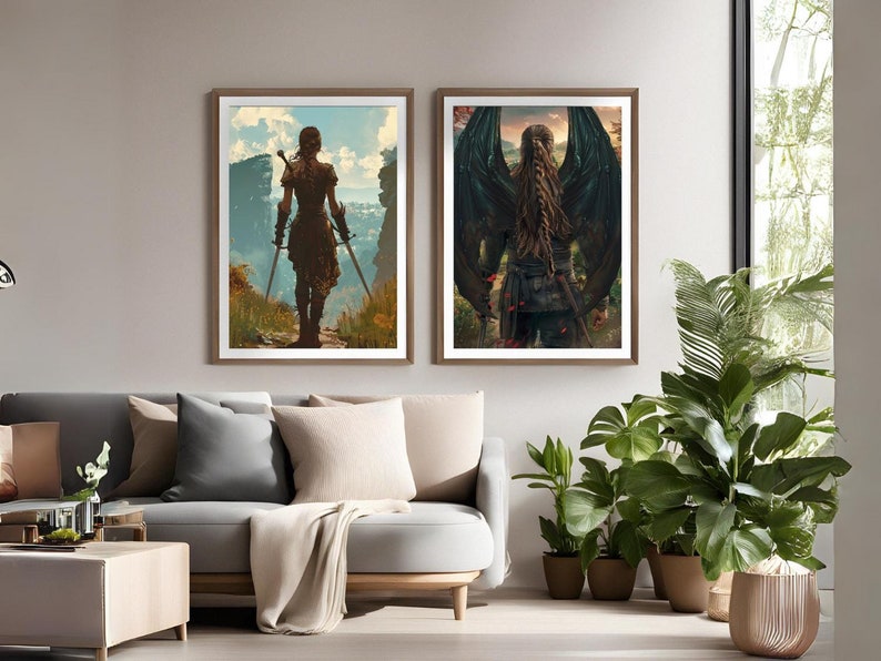 May include: Two framed prints of a woman with long brown hair wearing a dark outfit. The woman in the left print is holding two swords and standing on a path in a landscape. The woman in the right print has large black wings and is standing in a forest.