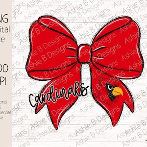 May include: A red bow with a black outline and the word "Cardinals" written in black cursive. The bow is tied around a red cardinal with a black beak and yellow accents.