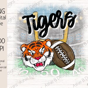 May include: A digital illustration of a cartoon tiger holding a football with the word "Tigers" written in black above it. The background is a green and white football field with a goal post and a crowd of people in the stands.