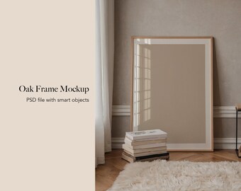 May include: A large oak frame mockup leaning against a wall, with the text "Oak Frame Mockup" and "PSD file with smart objects". The frame is empty, with a neutral beige background. A stack of books and a fluffy rug are in the foreground.