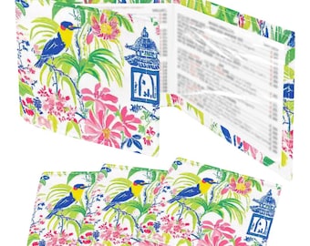May include: A set of white check presenters featuring a vibrant floral and bird pattern in shades of blue, yellow, pink, and green. The design includes illustrations of birds perched on branches, pink flowers, and blue pagoda-style structures.