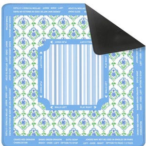 May include: A blue and white Mahjong mat with floral patterns and text indicating game instructions. The mat features a striped center and a black, non-slip backing. The text includes "Walls Left" and "Play Right."