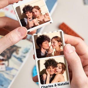 May include: A white Lego brick photo strip featuring three images of a couple. The bottom image has the text "Charles & Natalie" with a red heart. The couple is shown in various affectionate poses.