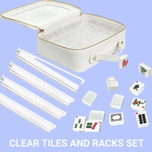 May include: A white Mahjong set with clear tiles and racks. The set includes a white carrying case with a clear lid, clear tile racks, and several white tiles with colorful symbols. The text "CLEAR TILES AND RACKS SET" is at the bottom.
