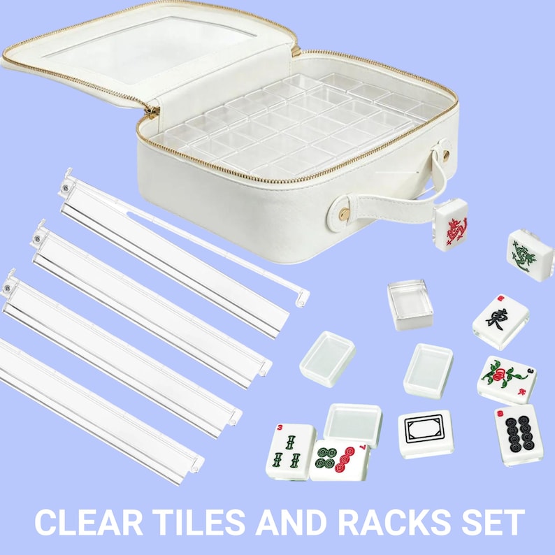May include: A white Mahjong set with clear tiles and racks. The set includes a white carrying case with a clear lid, clear tile racks, and several white tiles with colorful symbols. The text "CLEAR TILES AND RACKS SET" is at the bottom.