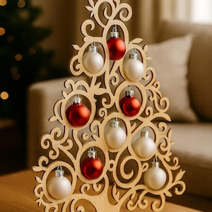 May include: Wooden Christmas tree decoration with a star on top, adorned with red and white ornaments. The tree has a decorative, openwork design and stands on a wooden base. A festive holiday accent.