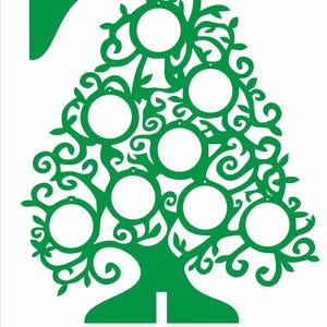 May include: Green Christmas tree-shaped ornament with circular openings for photos or decorations. The tree design features a star at the top and the word "Christmas tree" in red at the bottom. The ornament is on a white background.