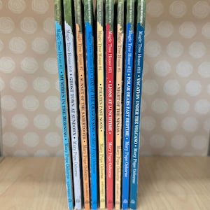 May include: A collection of ten Magic Tree House books by Mary Pope Osborne. The books are arranged in order from #3 to #13. The spines of the books are colorful and feature illustrations of various scenes from the stories. The titles of the books are visible on the spines.