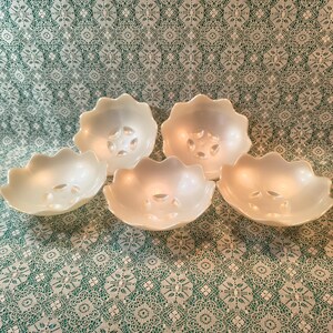 May include: A set of three ceramic mugs with a speckled, matte finish. The mugs are in shades of cream, light gray, and dark gray. Each mug has a simple, minimalist design, perfect for coffee or tea.