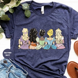 a women's t - shirt with a picture of disney princesses on it
