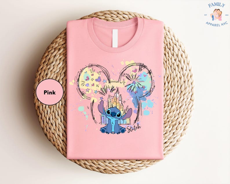 a pink shirt with a mouse on it