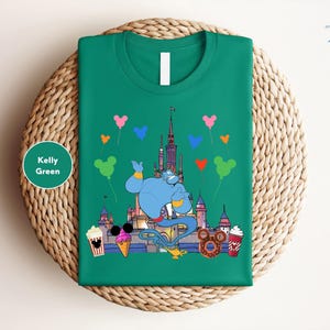 a green t - shirt with a picture of a cartoon character on it