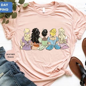 a t - shirt with a picture of a group of princesses on it