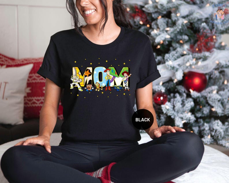 a woman sitting on a bed in front of a christmas tree
