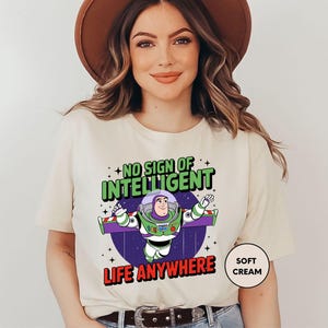 a woman wearing a t - shirt that says, no sign of intelligent life anywhere