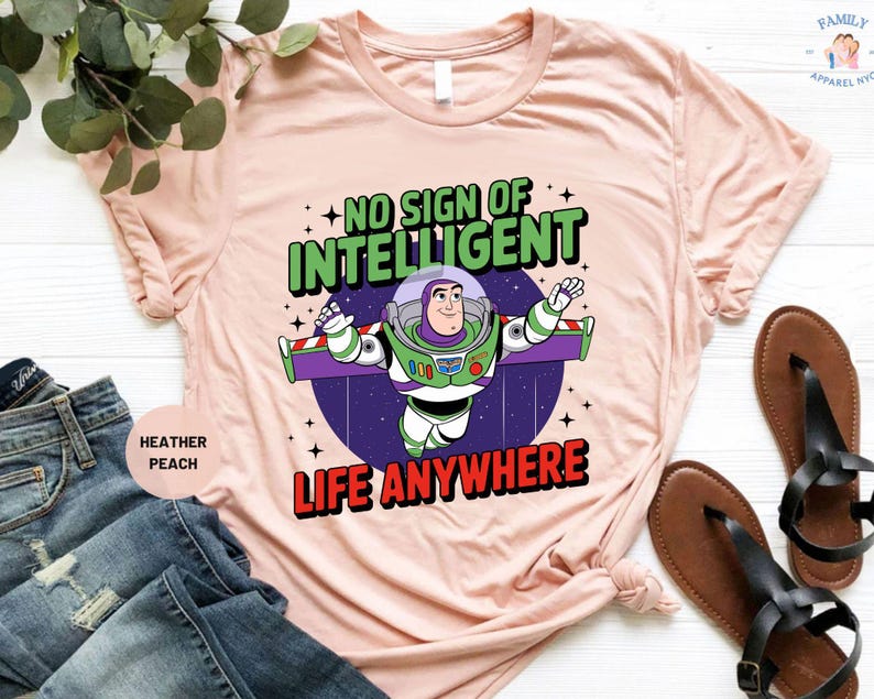 a pink t - shirt with an image of a cartoon character saying no sign of