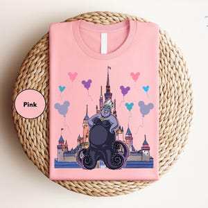 a pink shirt with a picture of a cartoon character on it