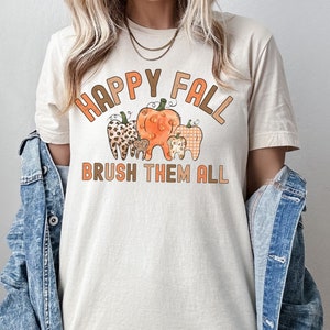 Happy Fall Brush Them All Dental Shirt, Fall Dental Assistant T-Shirt, Pumpkin Teeth RDH Tee, Dental Student Gift, Autumn Dentist Shirt