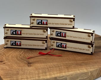 May include: Five wooden boxes with the word "du" and a heart design. Each box has a different message on it, such as "bist der beste Onkel der Welt!" (You are the best uncle in the world!).
