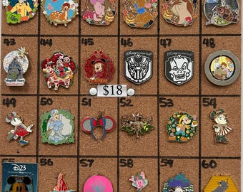 May include: A collection of twenty-four Disney-themed enamel pins arranged on a cork board, numbered 37 through 60. The pins feature various characters, logos, and icons, including Mickey Mouse, Winnie the Pooh, and Black Panther. A small sign reads $18.