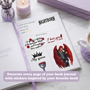 May include: A journal open to a page with stickers featuring quotes and imagery from the book "Nightborn." Stickers include a crown, a chalice, and a couple with red wings. The text "Decorate every page of your book journal with stickers inspired by your favorite book" is also visible.