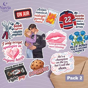 May include: A collection of stickers with various designs and text. Includes a red and blue hockey jersey, a couple embracing, a cookie, a VHS tape, and a bag of gummy bears. Text includes "On Air", "Gorgeous", and "Pack 2".