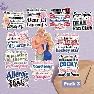 May include: A pack of stickers with various quotes and illustrations. The stickers feature phrases like "Taming Dean Di Laurentis," "Nothing stops a hockey game," and "I like my book boyfriends cocky and shirtless." The pack is labeled "Pack 3."