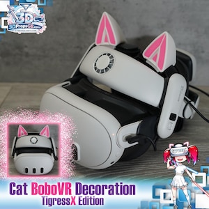 Peut inclure: Casque de réalité virtuelle blanc avec des oreilles de chat roses. Le casque a un design noir et blanc avec le texte "Cat BoboVR Decoration TigressX Edition" en bas. Une petite image du casque est également affichée.
