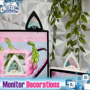 May include: The image showcases monitor decorations. Triangular-shaped decorations in black and white are displayed on and near a computer monitor. Each decoration features a heart design. The text "Monitor Decorations" is visible at the bottom of the image.