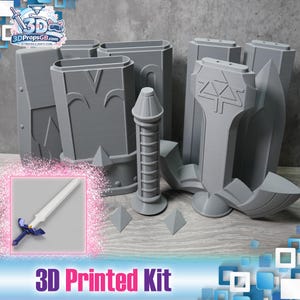 Peut inclure: Un kit imprimé en 3D gris comprenant divers composants, tels que des boucliers, une épée et des formes géométriques. Le kit est conçu pour le bricolage et comprend le texte "3D Printed Kit". Le logo "3DPropsGB.com" est également visible.