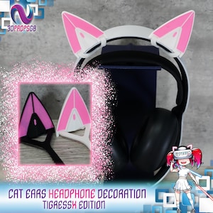 Puede incluir: Decoración de auriculares con orejas de gato rosas con una diadema blanca. Las orejas están impresas en 3D y tienen un interior blanco. La diadema está unida a unos auriculares negros. El texto "TigressX Edition" es visible debajo de la imagen.