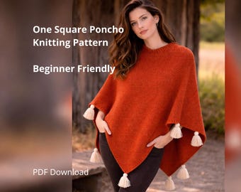 May include: An orange knitted poncho with cream-colored tassels at the corners. The poncho is worn by a person. Text on the image reads "One Square Poncho Knitting Pattern Beginner Friendly PDF Download."