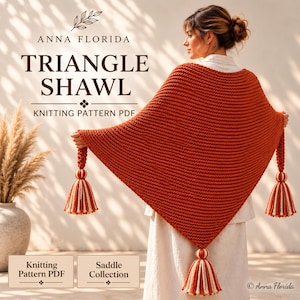 May include: A burnt orange knitted triangle shawl featuring a textured garter stitch pattern and three large decorative tassels in alternating orange and cream yarn. The text reads ANNA FLORIDA TRIANGLE SHAWL KNITTING PATTERN PDF SADDLE COLLECTION.