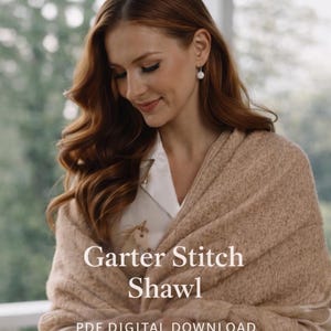 May include: A woman wearing a tan garter stitch shawl. The image includes the text "KNITTING PATTERN" and "Garter Stitch Shawl PDF DIGITAL DOWNLOAD". The shawl is draped over the shoulders.