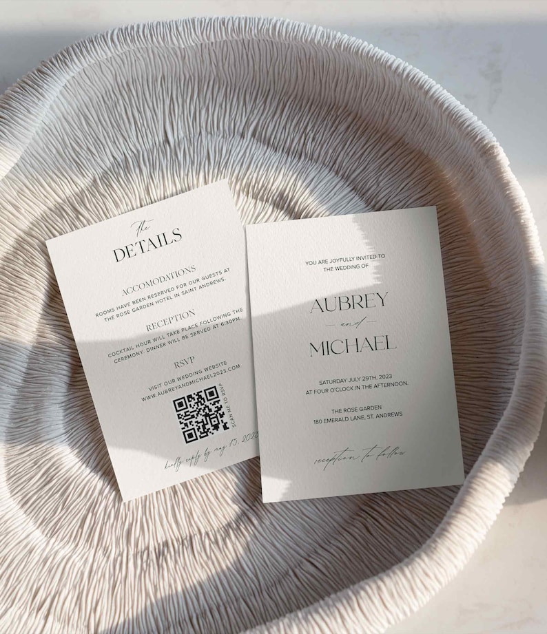 May include: A minimalist wedding invitation with a black and white color scheme. The invitation features the names Aubrey and Michael, the date and time of the wedding, and the location. A QR code is included for RSVP.