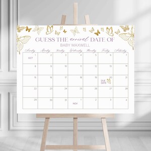 Puede incluir: Un calendario blanco con detalles de mariposas doradas y el texto "GUESS THE arrival DATE OF BABY MAXWELL". El calendario es para octubre y noviembre y tiene un cuadro morado alrededor de la fecha de parto.