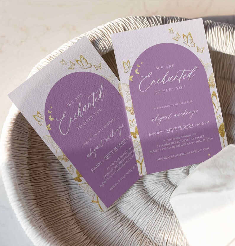 May include: A purple and white invitation with gold butterflies and the text "We are Enchanted to meet you" and "Abigail Raekenpe" with the date and time of the event. The event is at the Rose Garden Inn on Sunday, 15 September 2023 at 3 PM.