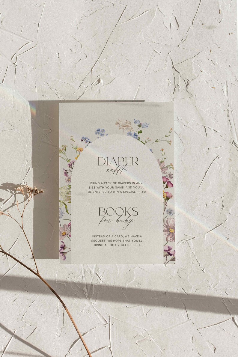 May include: A white card with floral borders and text that reads "Diaper Raffle" and "Bring a pack of diapers in any size with your name, and you'll be entered to win a special prize!" and "Books for baby" and "Instead of a card, we have a request! We hope that you'll bring a book you like best."