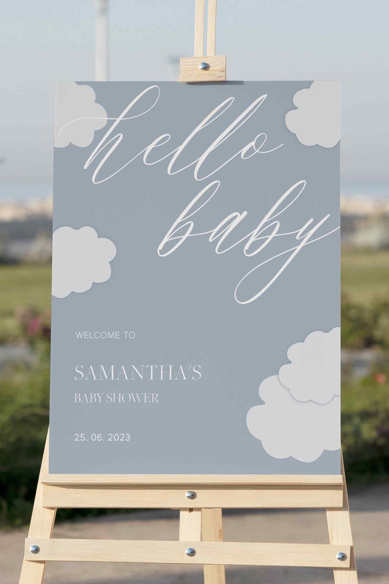 K&ouml;nnte beinhalten: Ein blaues und wei&szlig;es Willkommens-Schild f&uuml;r eine Babyparty mit dem Text "hello baby" und "Samantha's Baby Shower" mit dem Datum "25.06.2023".