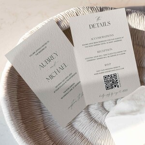 May include: Wedding invitation with a white background and black text. The invitation is for Aubrey and Michael's wedding on Saturday, July 29th, 2023 at 4:00 PM at The Rose Garden, 180 Emerald Lane, St. Andrews. The invitation also includes details about the reception and accommodations.