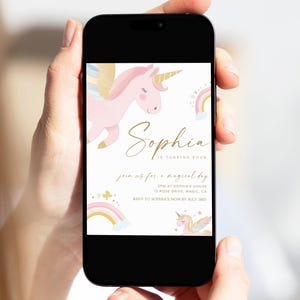 May include: A smartphone displays a birthday invitation with a unicorn theme. The invitation features a pink unicorn, rainbows, and the name "Sophia" in gold script. The text reads "Join us for a magical day."