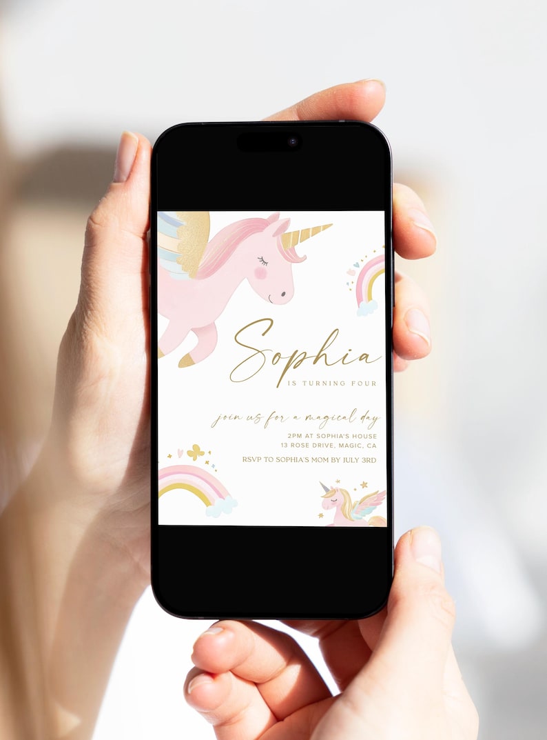 May include: A smartphone displays a birthday invitation with a unicorn theme. The invitation features a pink unicorn, rainbows, and the name "Sophia" in gold script. The text reads "Join us for a magical day."