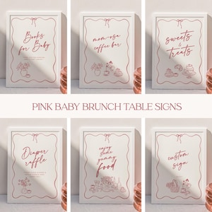May include: A collection of six white framed signs with pink text and illustrations. The signs read "Books for Baby", "Mom-osa Coffee Bar", "Sweets & Treats", "Diaper Raffle", "Enjoy Some Yummy Food", and "Custom Sign". The signs are for a baby brunch.