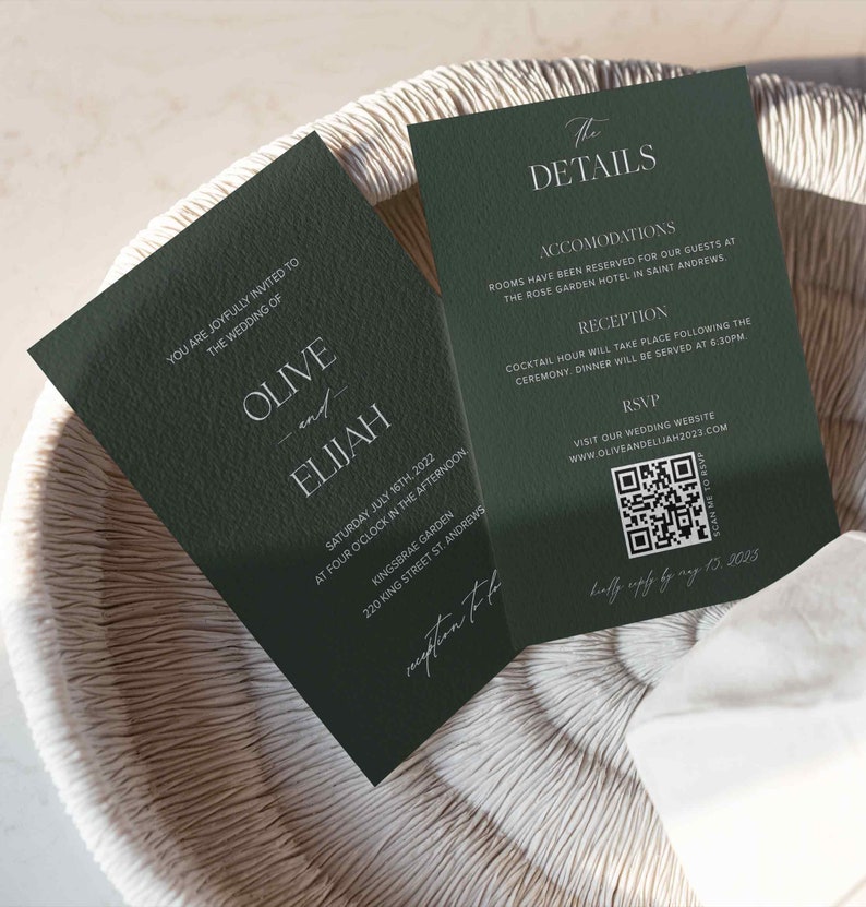 May include: A green wedding invitation with white text. The invitation is for Olive and Elijah's wedding on Saturday, July 16th, 2022 at 4:00 pm at Kingsbrae Garden, 220 King Street St. Andrews. The back of the invitation has details about the wedding, including accommodations, reception, and RSVP information. There is a QR code for the RSVP website.
