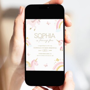 May include: A smartphone displays a birthday invitation for Sophia's fourth birthday. The invitation features a pastel color scheme with unicorns, rainbows, and butterflies. The text includes the date, time, and location of the party.